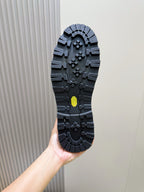 Moncler suede Chelsea boots outsole tread with textured rubber and small yellow detail