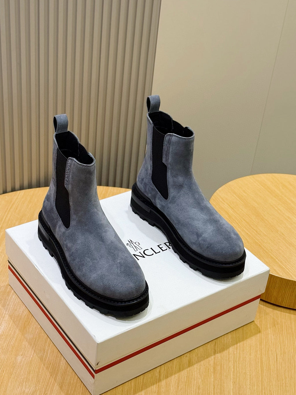 Moncler suede Chelsea boots with elastic side panels and dark rubber sole, pair view