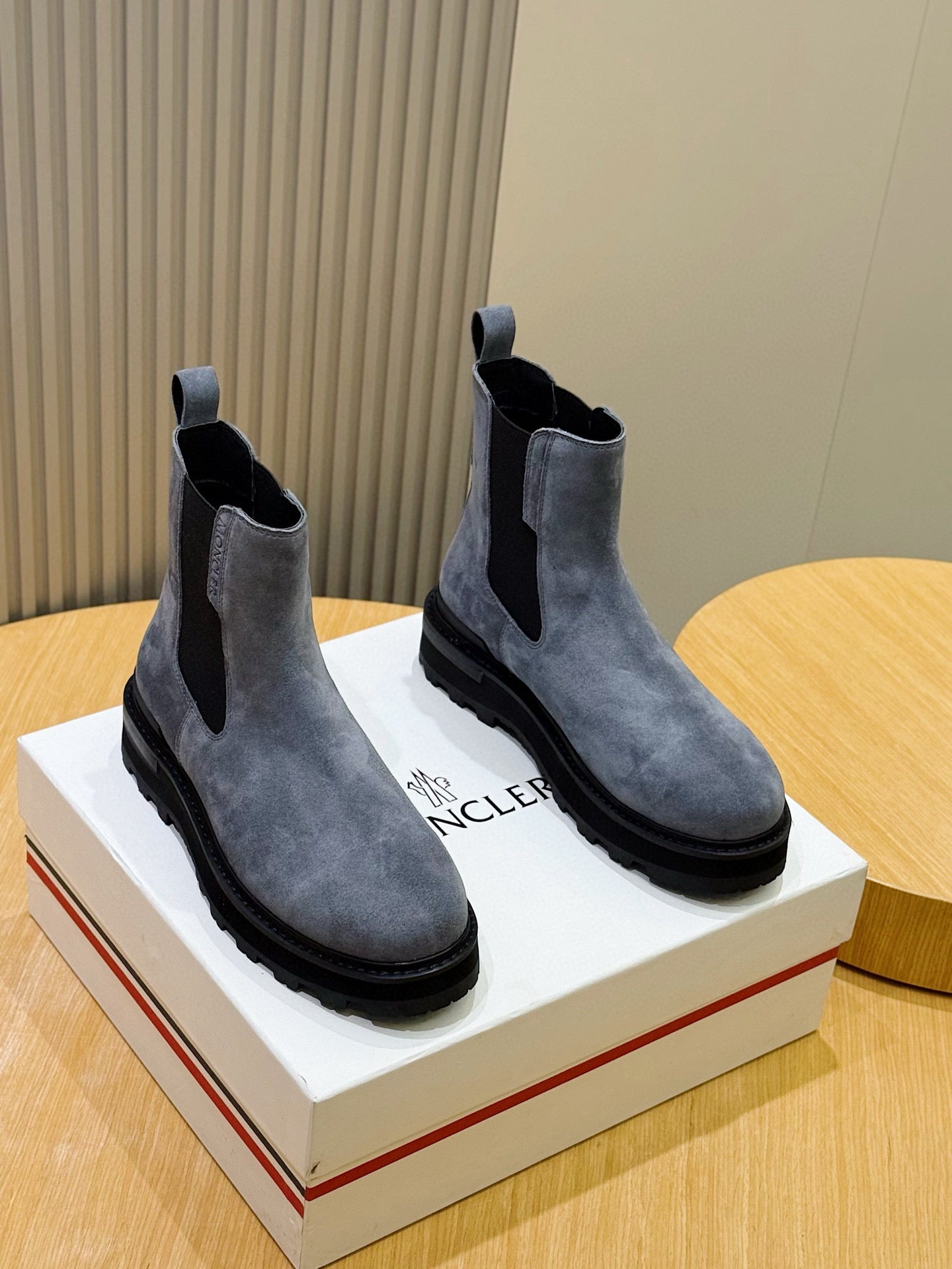 Moncler suede Chelsea boots with elastic side panels and dark rubber sole, pair view