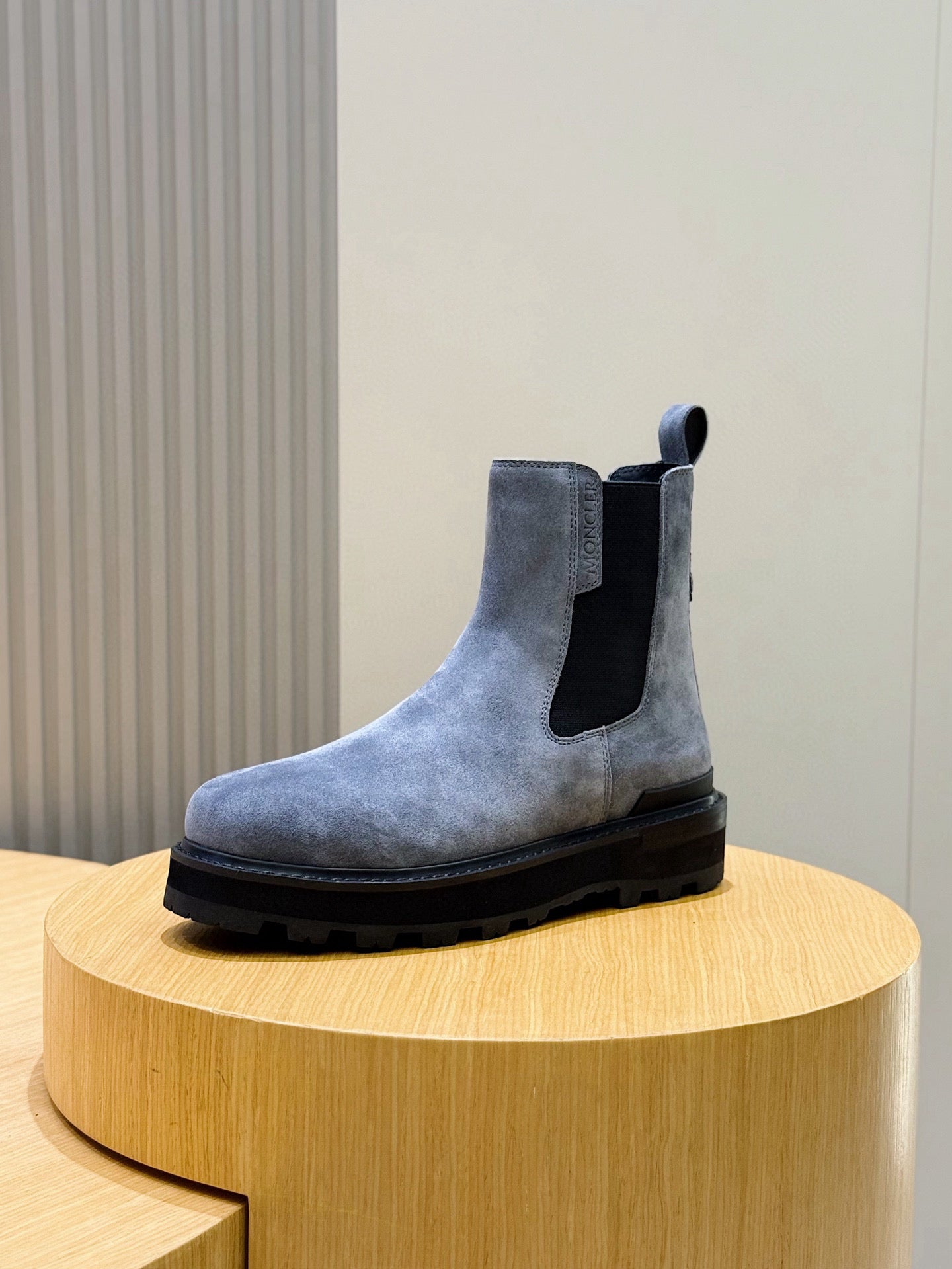 Moncler suede Chelsea boot with elastic side gore and dark rubber sole, side view