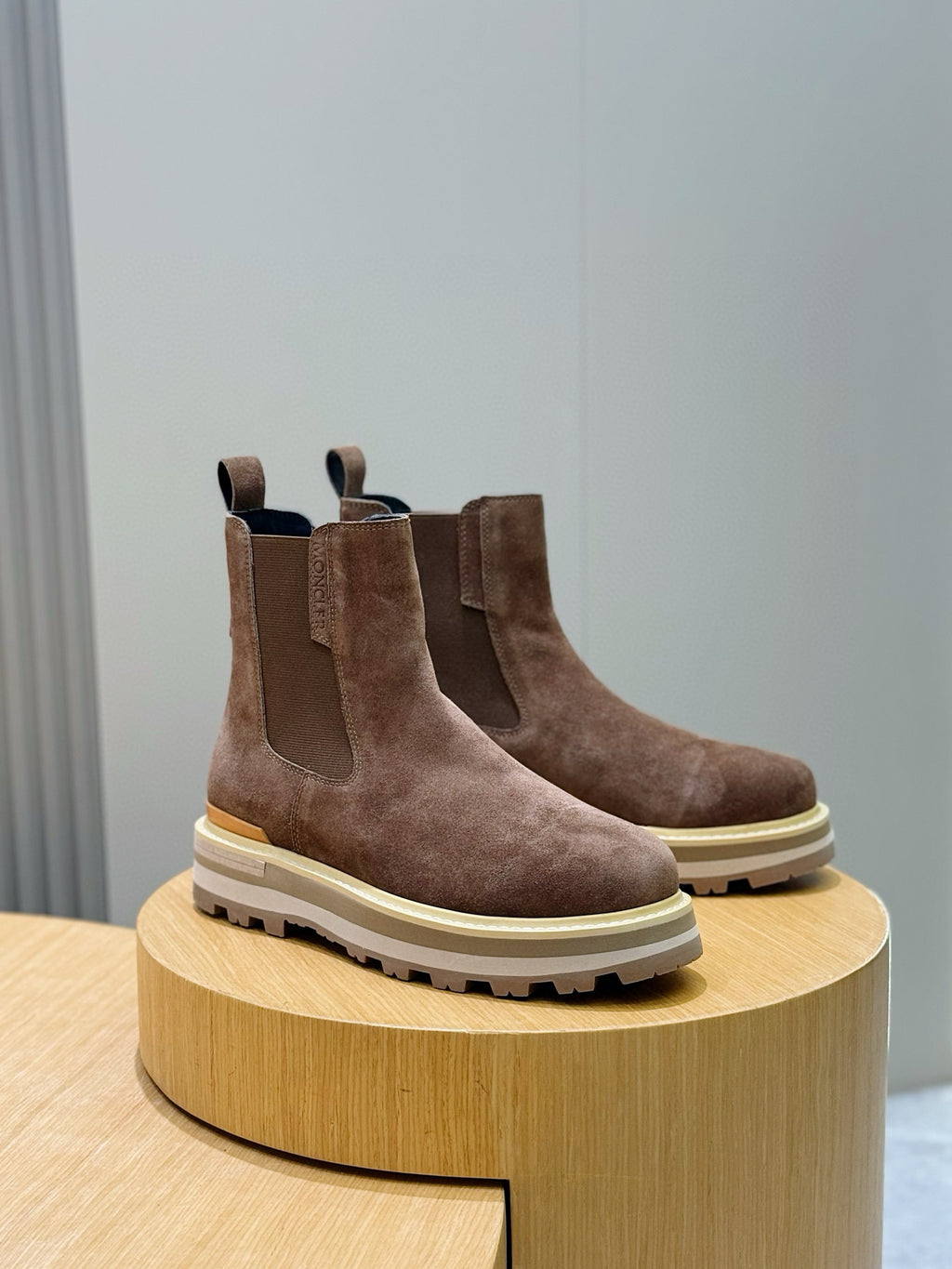 Moncler brown suede Chelsea boots on round pedestal, thick rubber lug sole