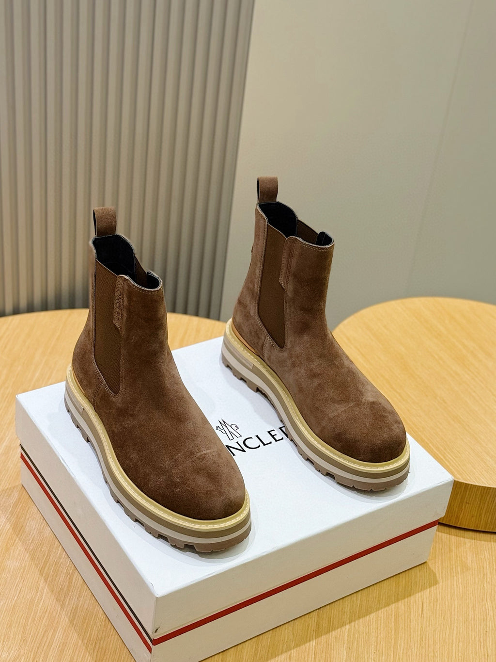 Moncler brown suede Chelsea boots, side view with elastic gore and rubber sole