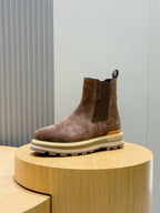 Moncler brown suede Chelsea boot on display, ankle height with elastic side panels