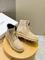 Light beige suede lace-up ankle boots with dark blue inner lining and tan sole