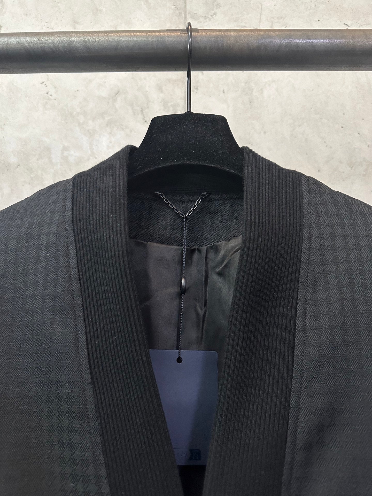 Long-sleeve jacket neckline and inner placket, dark fabric with multicolor trim