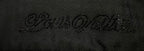 Black textured fabric close-up with embossed logo-style pattern