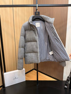 Moncler long quilted puffer jacket open, light gray, showing pale lining and zipper