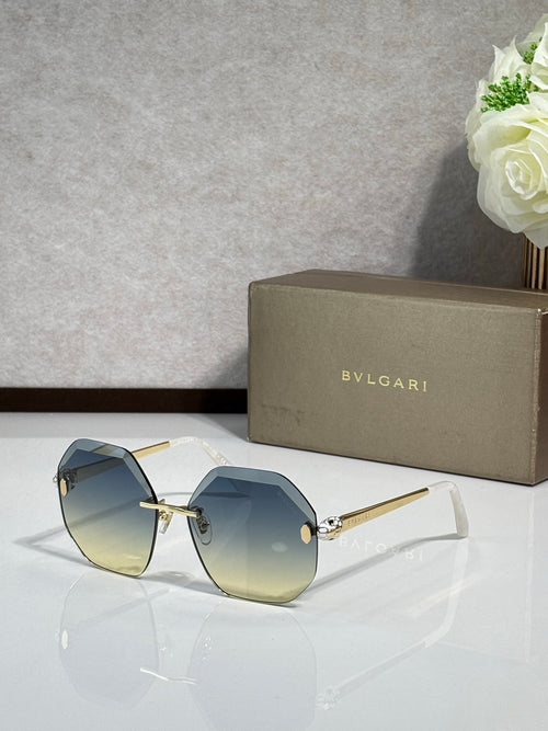 Sunglasses with blue-tinted lenses and gold-tone frame, slim temple arms.