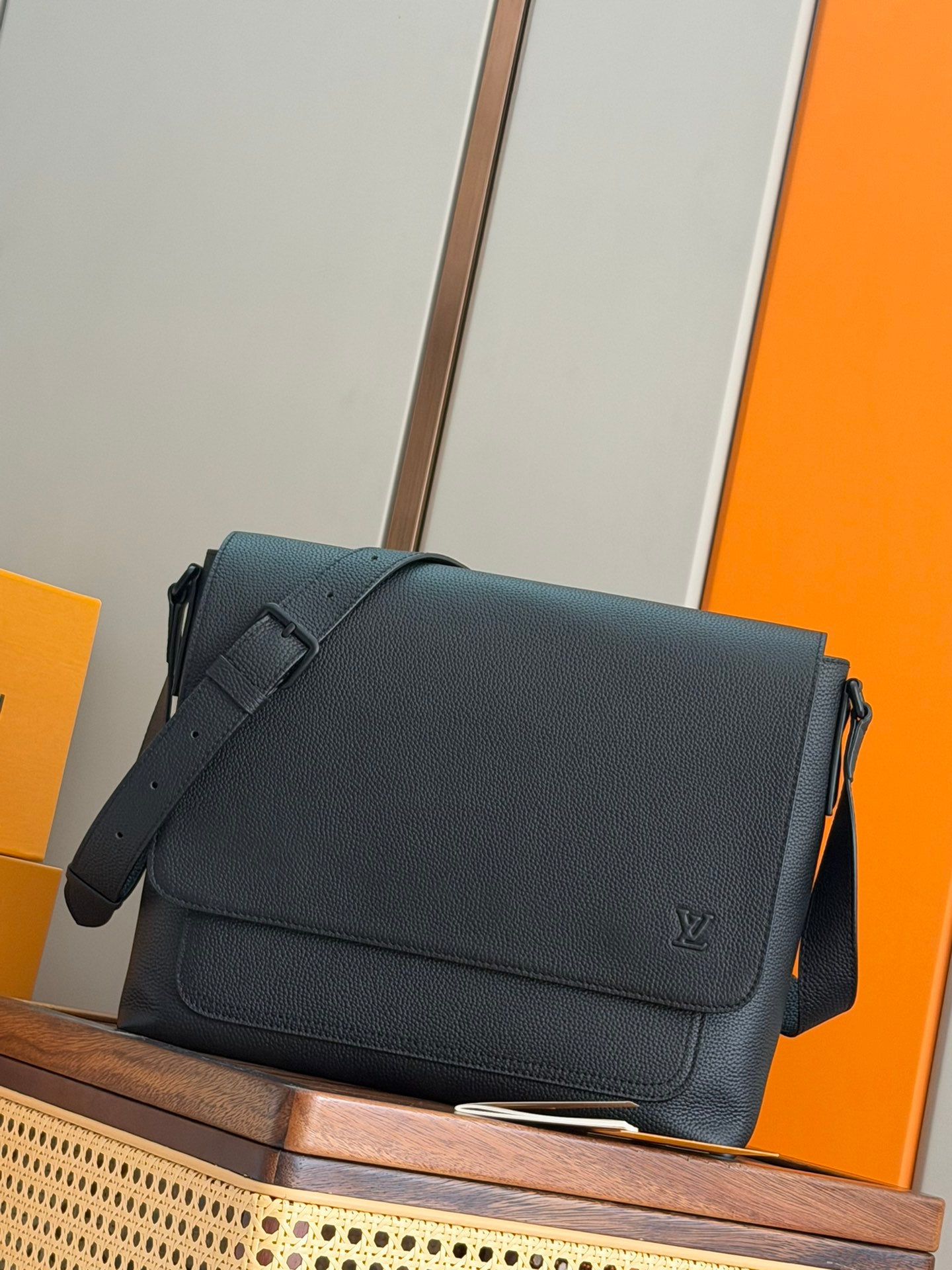 Men's Louis Vuitton shoulder bag in dark teal leather with front flap and strap