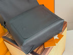 Men's Louis Vuitton shoulder bag in dark teal leather with stitched flap and snap