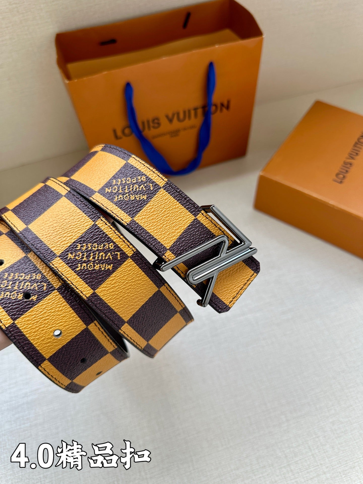 Louis Vuitton Damier check belt buckle with patterned strap and engraved branding