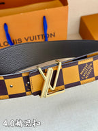 Louis Vuitton belt close-up with gold buckle and Damier check strap in dark and yellow