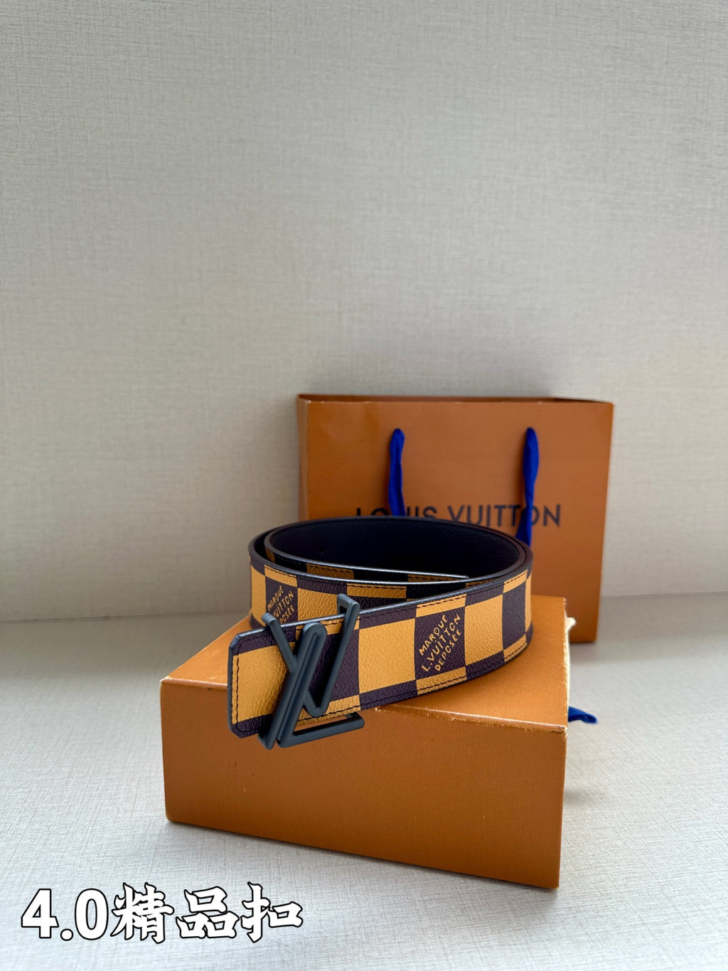 Checkered leather belt with dark blue and yellow pattern, metal buckle
