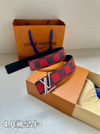 Checked fabric belt with red-and-navy pattern and V-shaped metal buckle