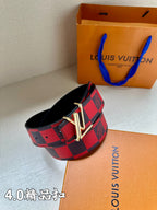 Checked fabric belt with red-and-navy pattern and gold-tone metal V buckle