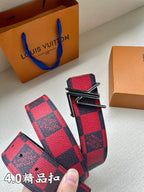 Checked belt buckle detail with red panels and dark navy trim
