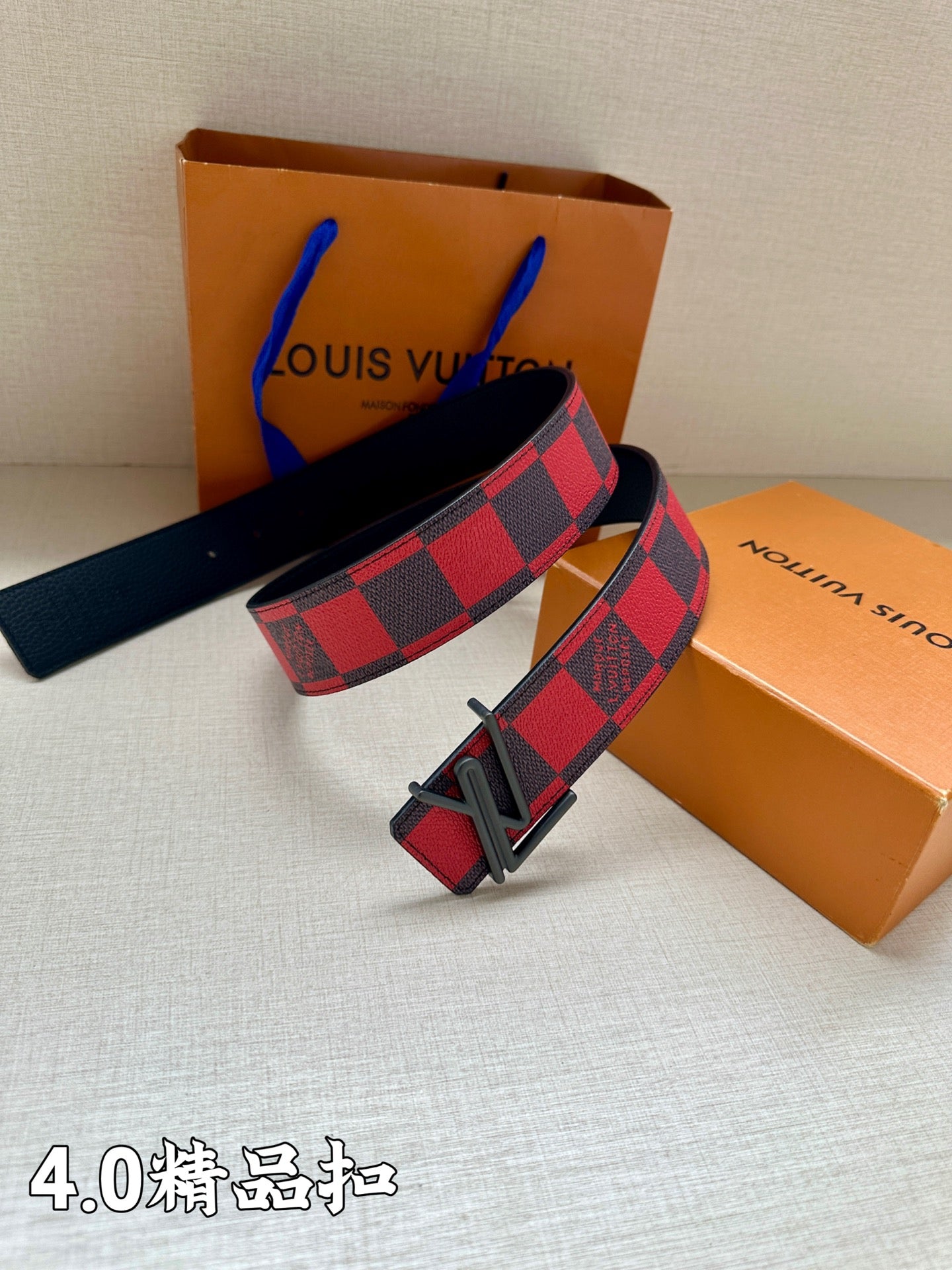 Check belt with black buckle, red and navy grid strap