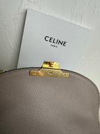 Celine taupe top edge hardware with gold latch and stud accents