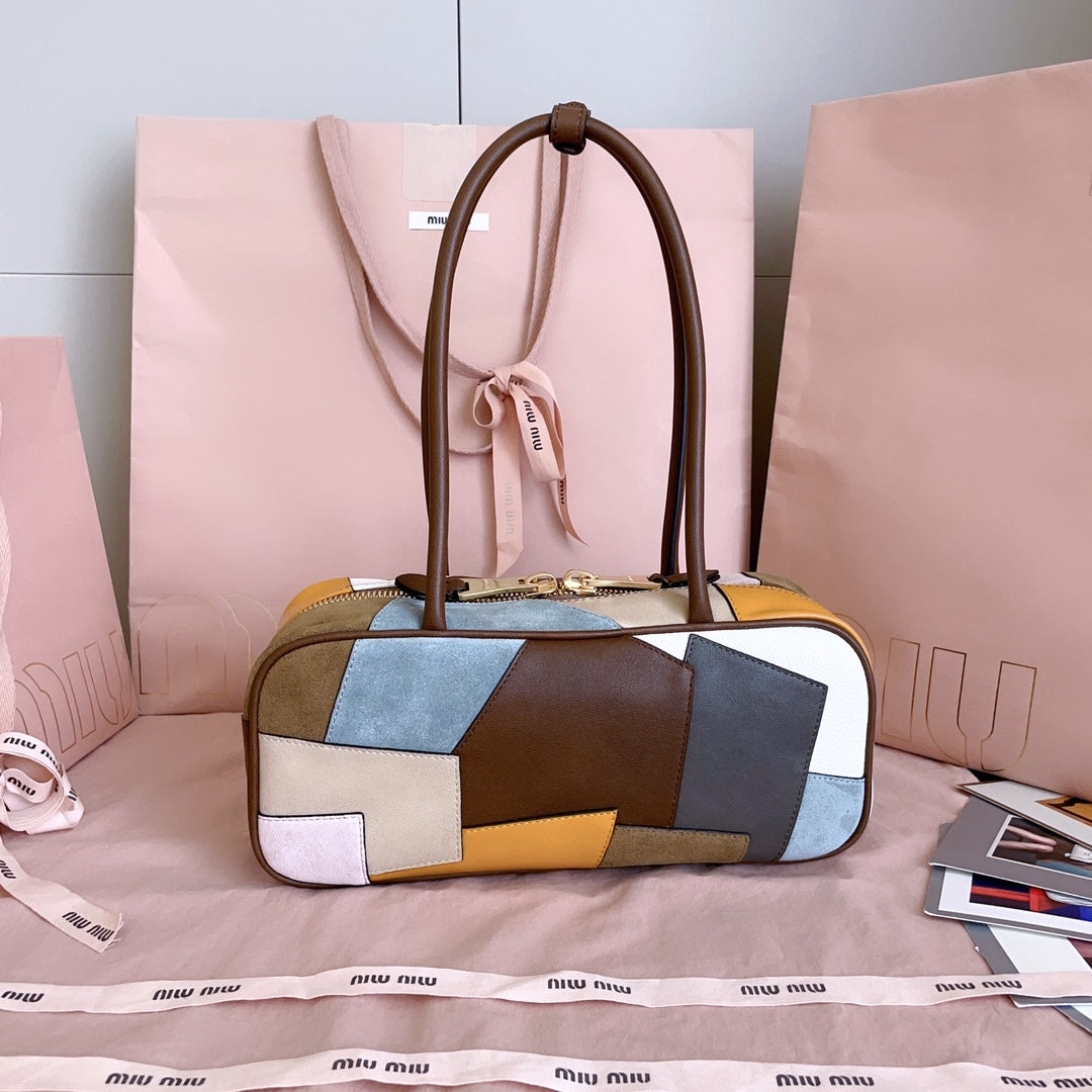 MiuMiu patchwork leather handbag with top handles and front zipper in multi-color blocks