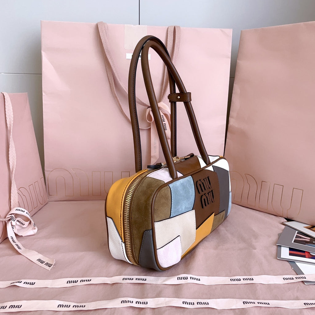MiuMiu patchwork leather top-handle bag with gold zipper and brown leather trim
