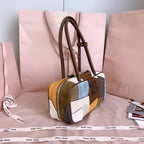 MiuMiu patchwork leather top-handle bag with gold zipper and brown leather trim