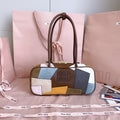 MiuMiu color-block leather top-handle bag with brown handles and patchwork panels