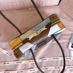 MiuMiu patchwork leather handbag with zipper end, multicolor blocks and top handle