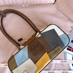 MiuMiu patchwork leather bag with embossed MiuMiu logo and multi-tone side panels