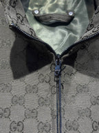 Gucci-pattern zip jacket front with exposed zipper and dark trim