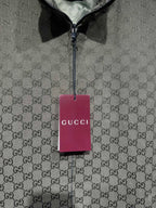 Gucci-pattern zip jacket with hanging brand tag