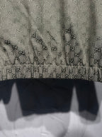 Gucci long garment with GG monogram fabric, dark trim panels