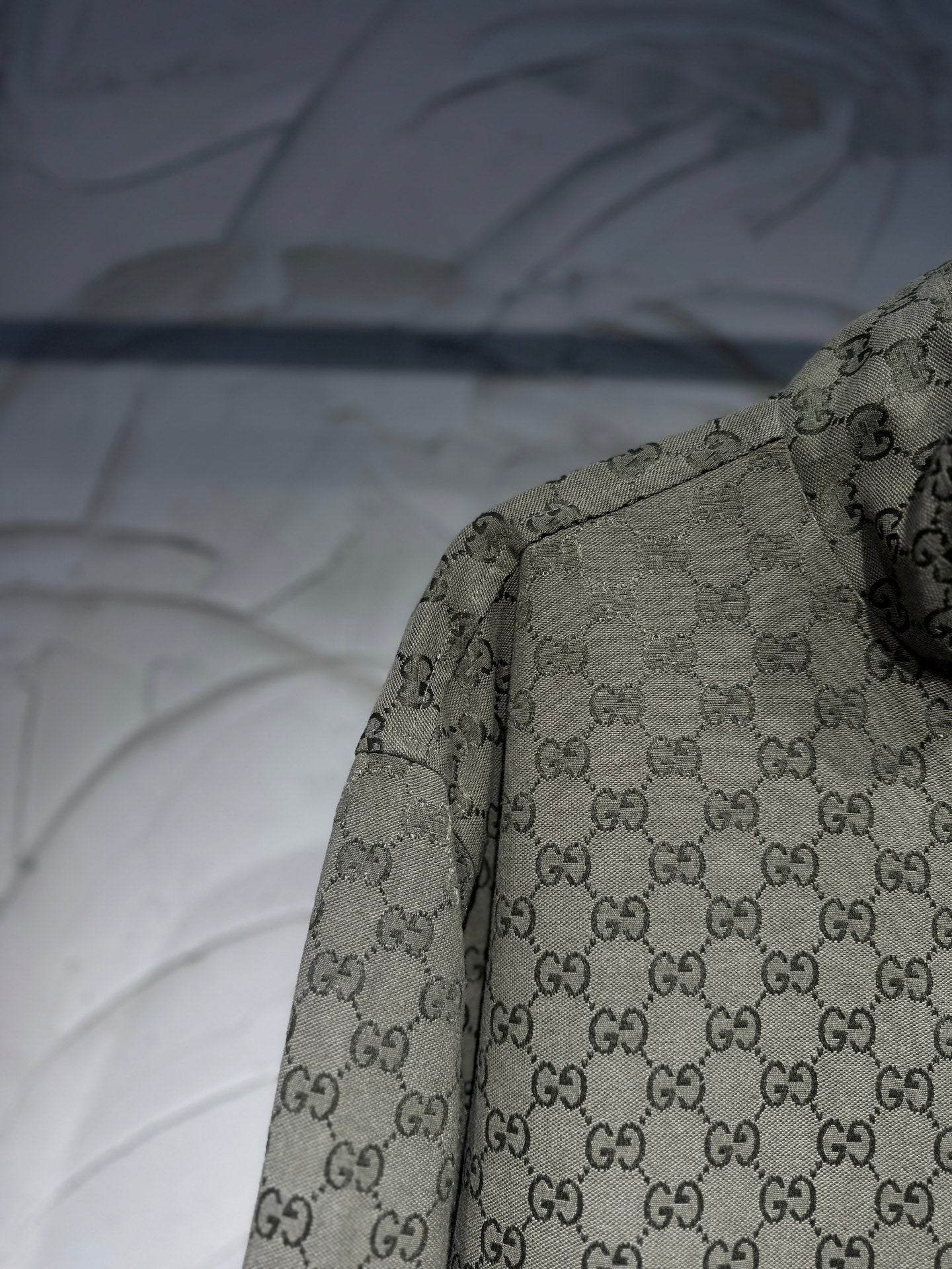 Gucci-pattern jacket sleeve and shoulder view