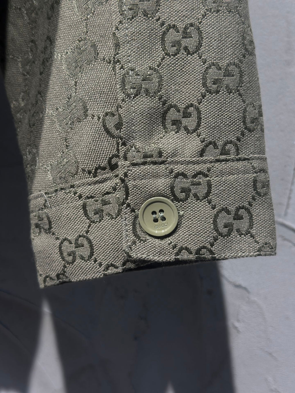 GG monogram long garment cuff with button detail
