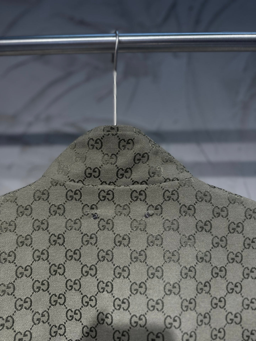 Gucci-pattern hooded jacket top view with allover GG print