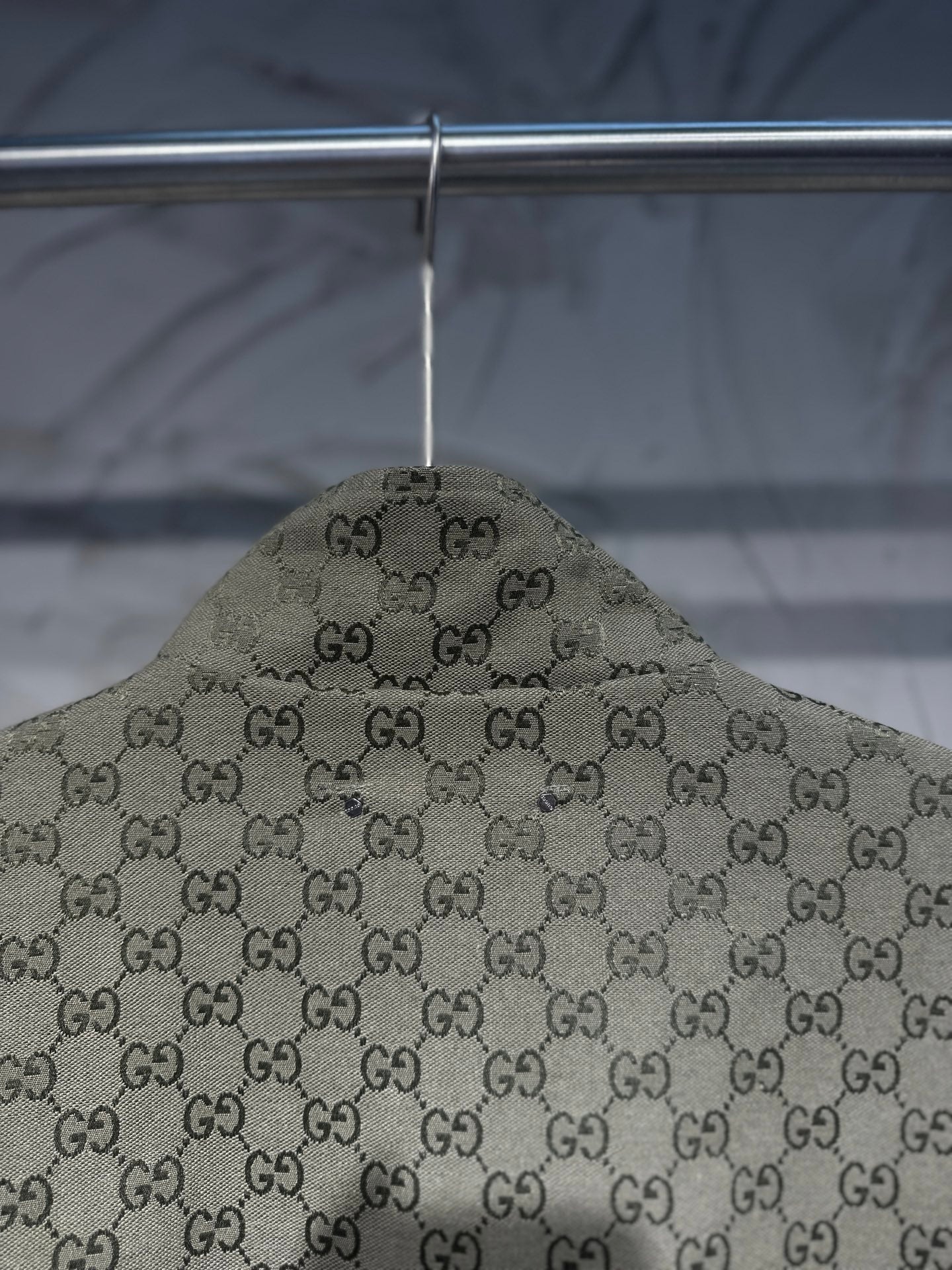 Gucci-pattern hooded jacket top view with allover GG print