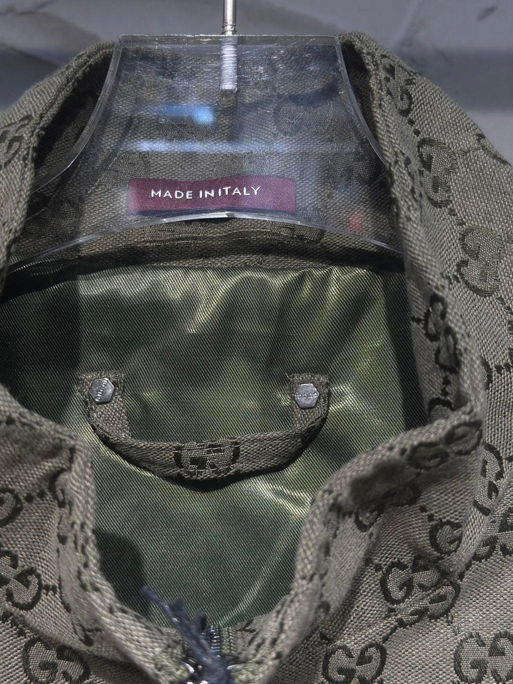 Gucci-pattern jacket inner lining and front pocket detail