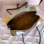 MiuMiu patchwork leather handbag interior with brown lining and gold zipper closure