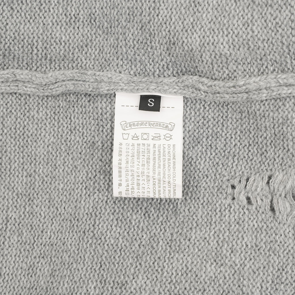 Heather gray knit sweater size label marked “S”