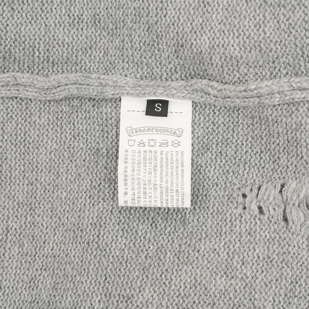 Heather gray knit sweater size label marked “S”