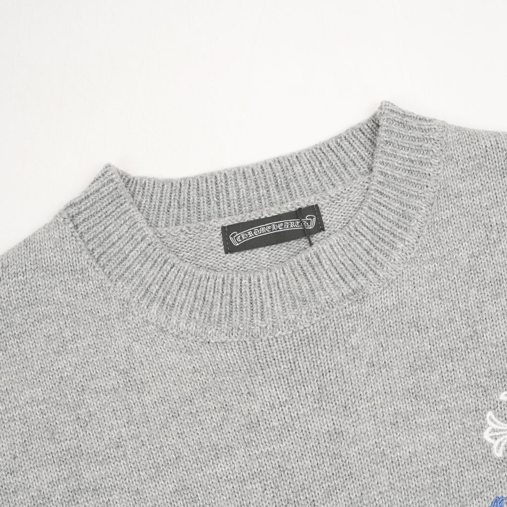 Heather gray knit sweater neckline with small brand label