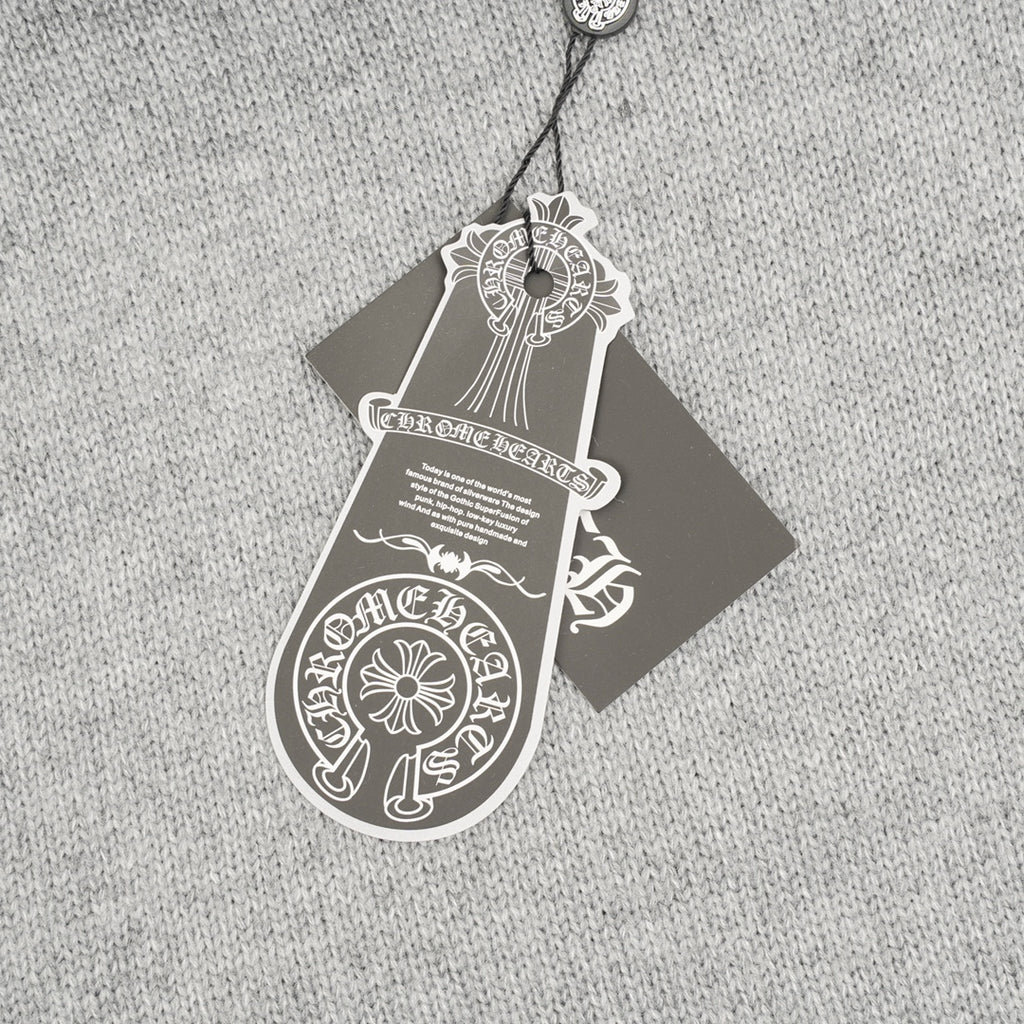 Heather gray knit sweater with attached hanging care tag