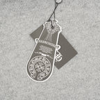 Heather gray knit sweater with attached hanging care tag
