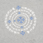 Heather gray sweater close-up of blue-and-white circular embroidered motif