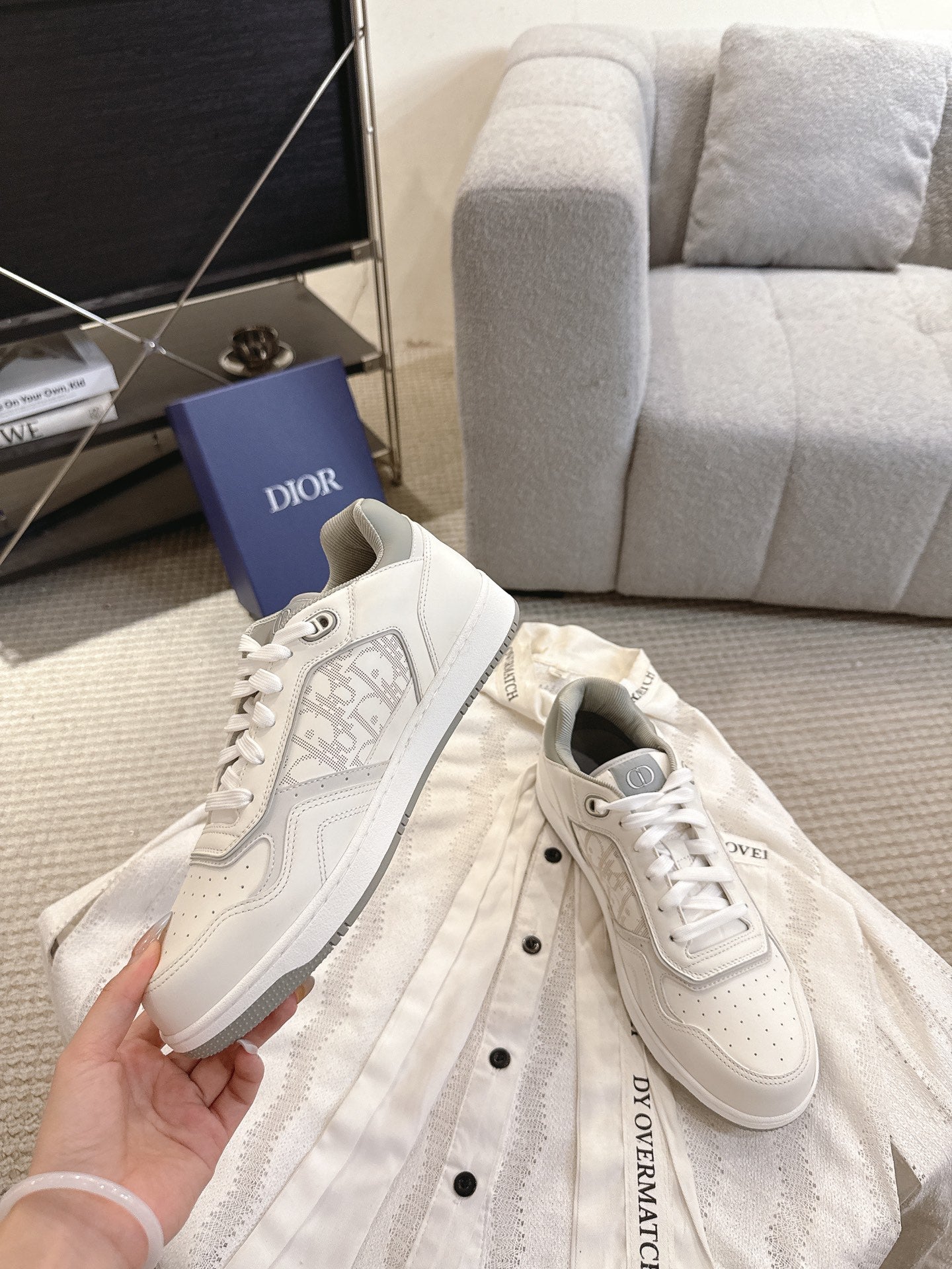 Dior unisex sneakers with lace-up closure, white leather upper and side logo trim