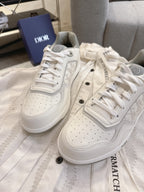 Dior unisex low-top sneakers, white leather with textured paneling and lace-ups