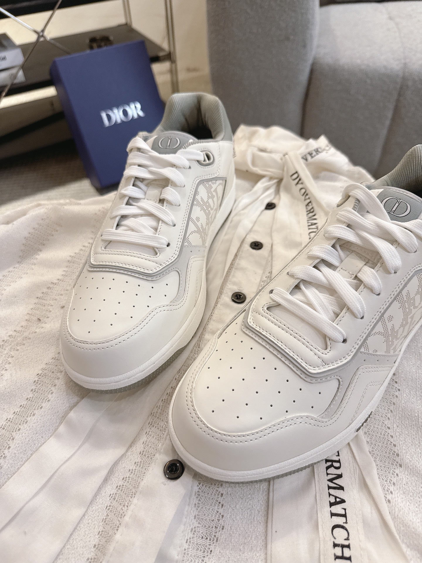 Dior unisex low-top sneakers, white leather with textured paneling and lace-ups