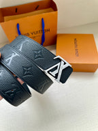 Louis Vuitton belt close-up of dark blue textured leather and silver LV buckle