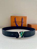 Louis Vuitton belt in dark blue embossed leather with large silver LV buckle