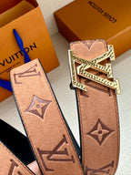 Louis Vuitton belt strap detail with monogram print and gold-tone LV buckle