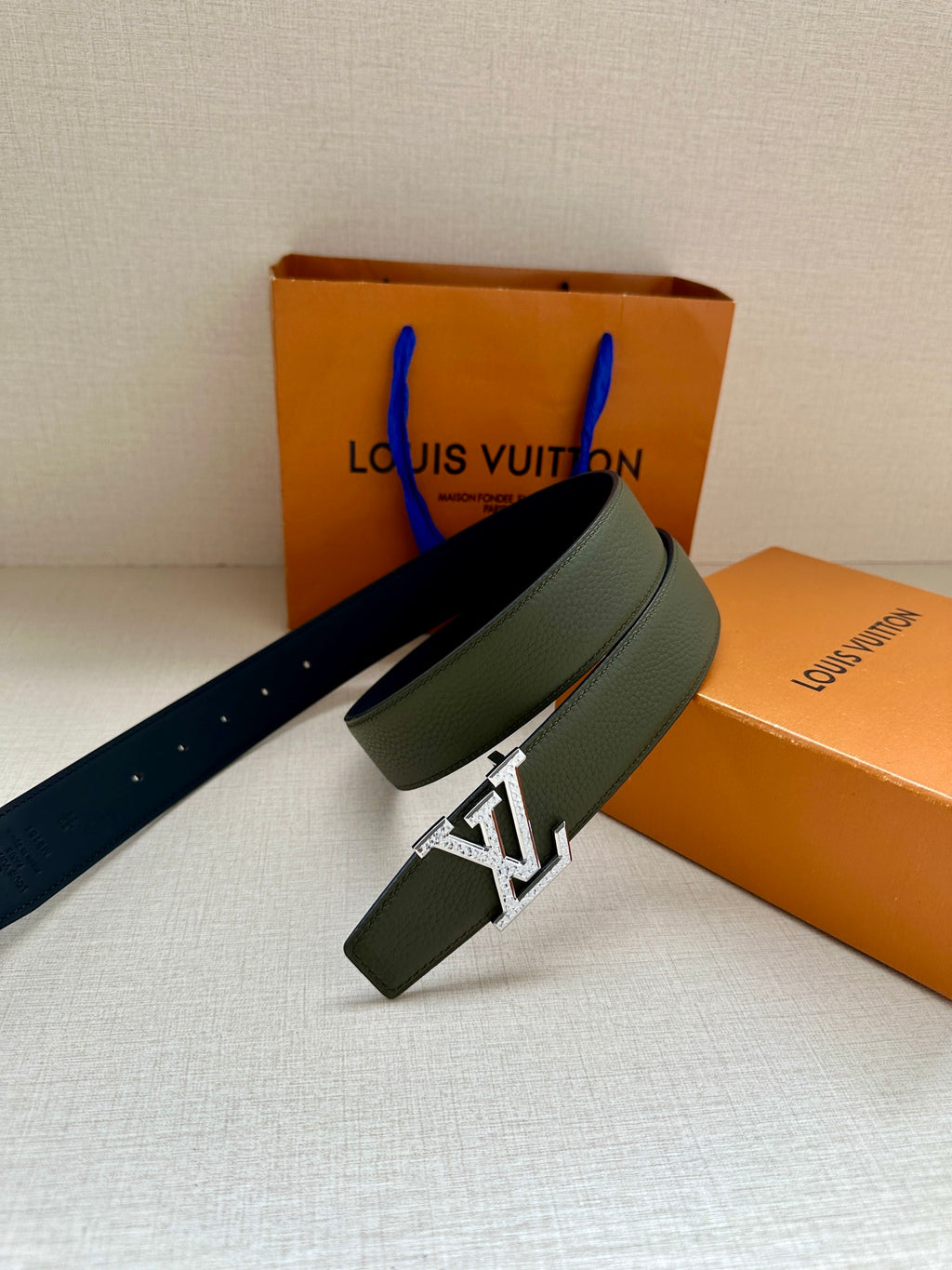 Dark green leather belt with silver LV buckle